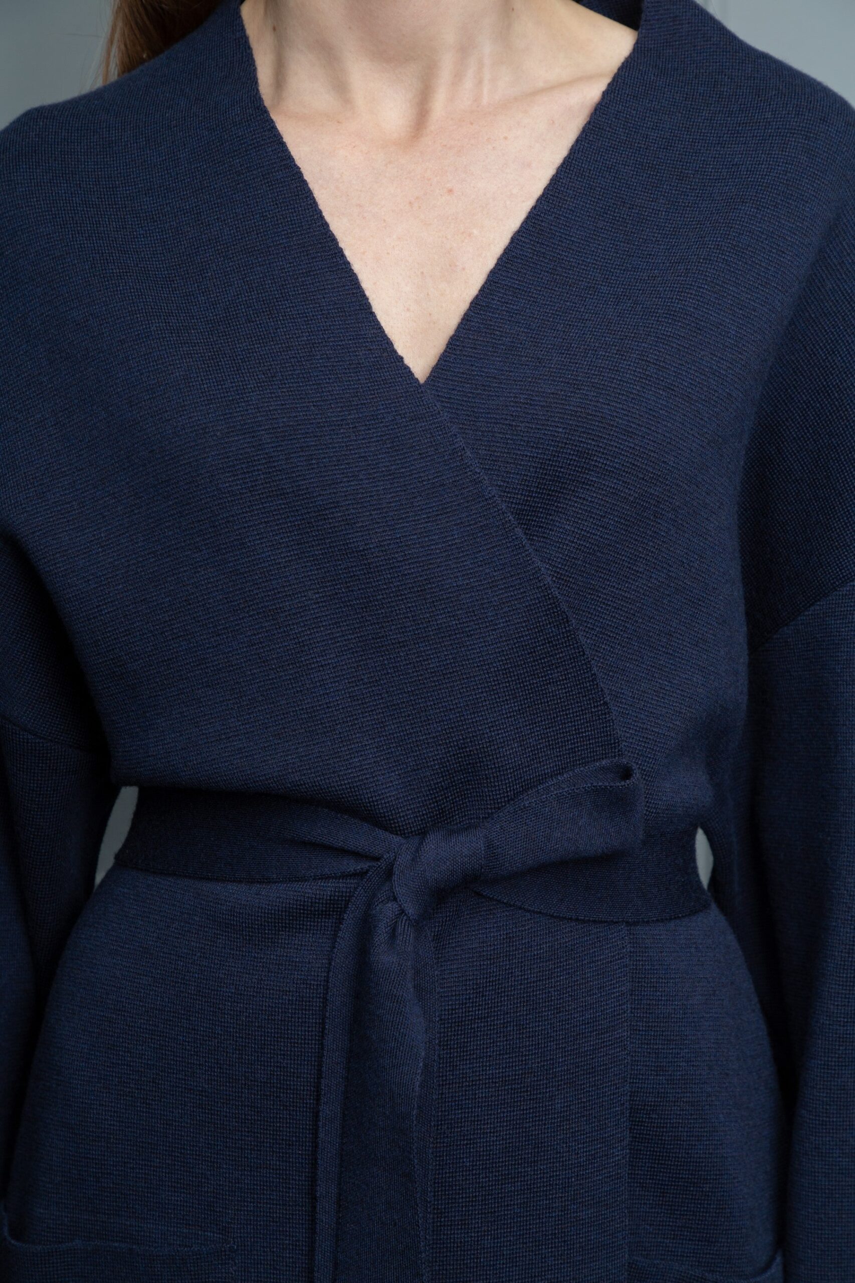 Dark blue woolen cardigan with belt